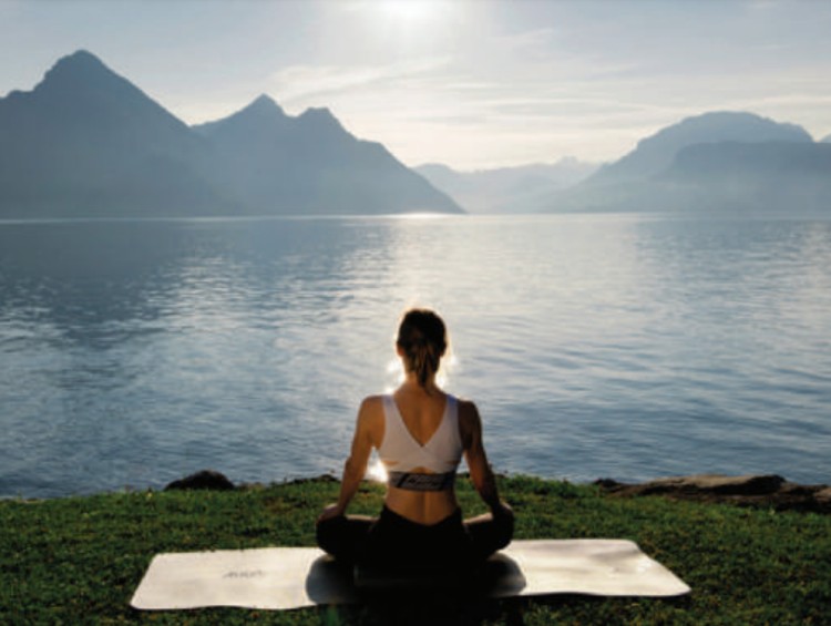 woman sitting on excercise mat