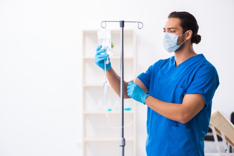 Doctor using IV Drip pole